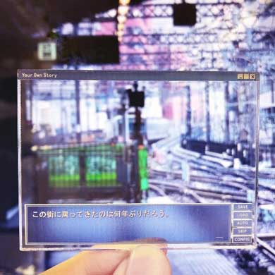 主人公レンズ ギャルゲー キーホルダー ヴィレッジヴァンガード 発売