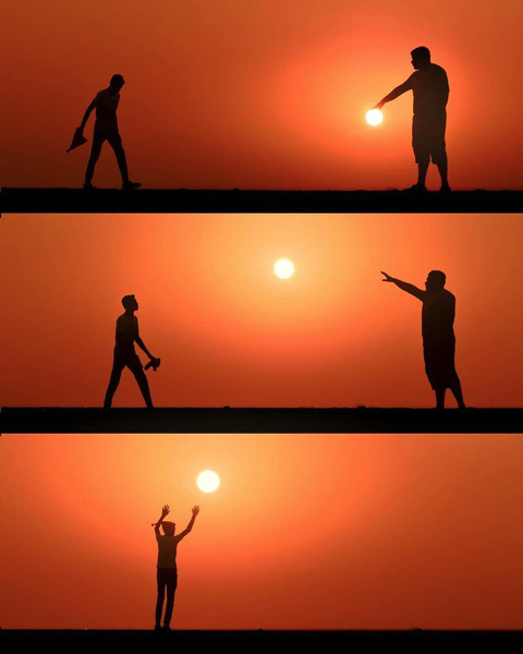 夕日にシルエットを重ねた写真