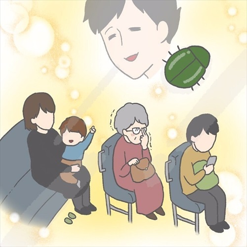 カナブンを指さす赤ちゃん