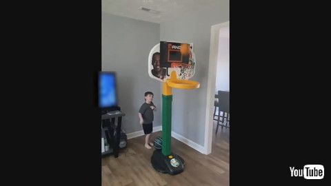 「Kid Performs Cool Trick Shots By Putting Different Balls Through Mini Basketball Hoop - 1186085」