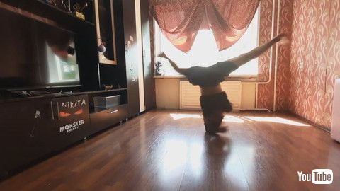 「Kid Performs Multiple Spins On Elbow - 1203607」