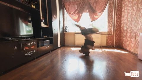 「Kid Performs Multiple Spins On Elbow - 1203607」