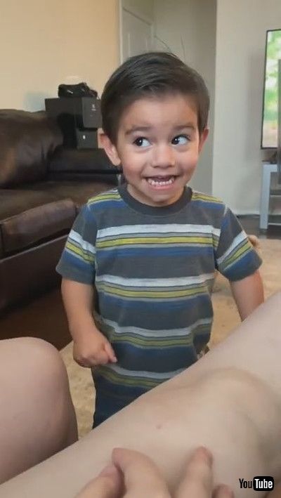 「Little Boy Quivers Trying to Cross his Eyes Like his Dad - 1200094」