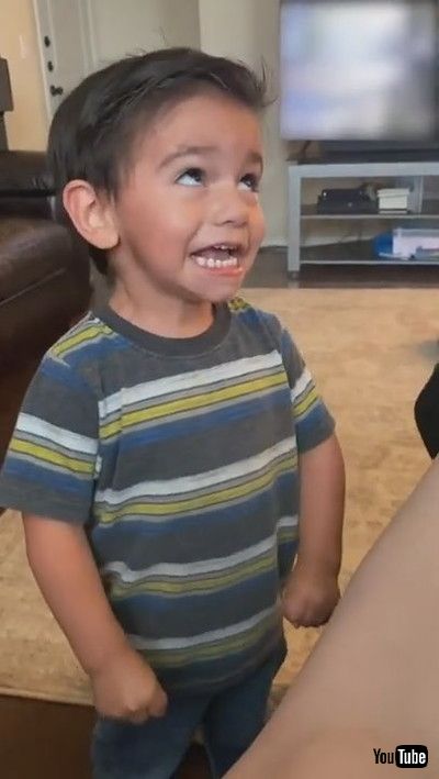 「Little Boy Quivers Trying to Cross his Eyes Like his Dad - 1200094」