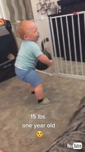 「Toddler Lifts Fifteen-Pound Heavy Medicine Ball by Himself - 1229660」