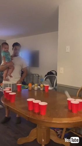 「Toddler Participates in Beer Pong Game and Cheers Over Hitting Mark - 1261265」
