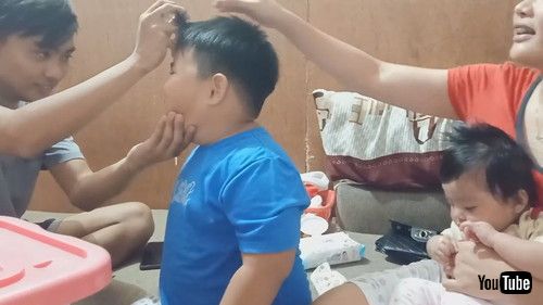 「Boy Watches in Amazement While Sibling Performs Magic Trick - 1205861」
