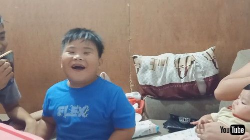 「Boy Watches in Amazement While Sibling Performs Magic Trick - 1205861」