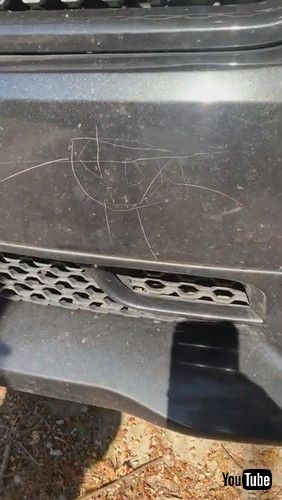 「Little Kid Draws On Mother's Car With Screwdriver While Father Works Nearby - 1269650」