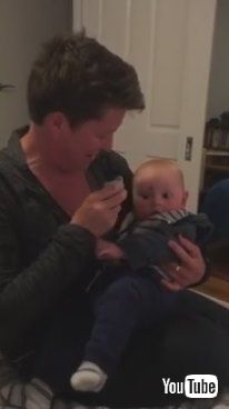 「Baby Laughs at Mom Putting Pacifier in Mouth - 985799」