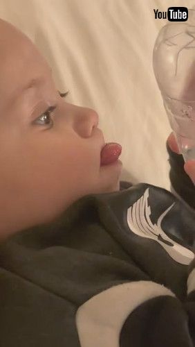 「Baby Tries Drinking Water From Bottom Of Bottle - 1279880」