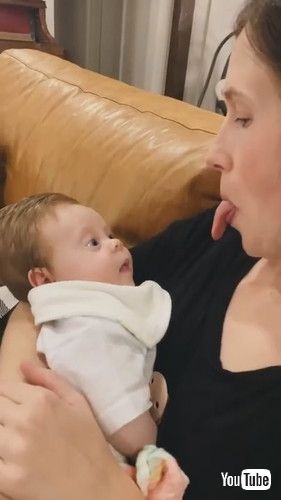 「Baby Copies Mom as She Sticks Her Tongue Out - 1281269」