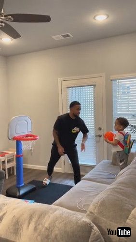「Toddler Repeatedly Shoots Mini Basketball Into Hoop - 1281365」