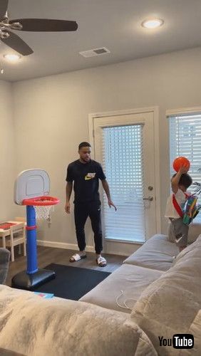 「Toddler Repeatedly Shoots Mini Basketball Into Hoop - 1281365」