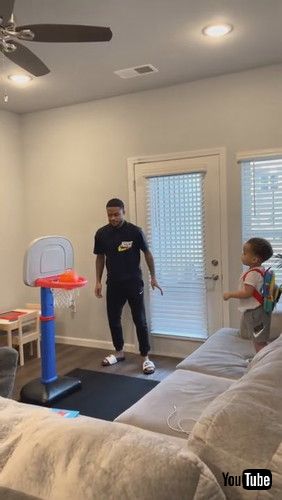 「Toddler Repeatedly Shoots Mini Basketball Into Hoop - 1281365」