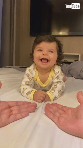 「Baby Can't Decide Between Mom or Dad's Hand || ViralHog」