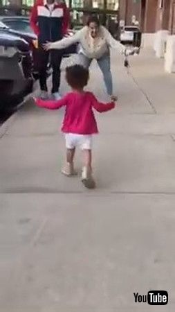 「Little Girl Ignores Mom Waiting To Hug Her And Proceeds Towards Her Grandpa - 1335367」