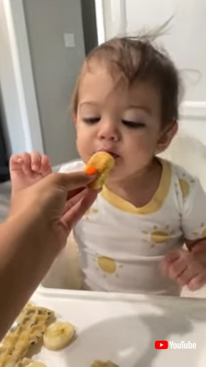 Toddler Pretends to Eat Bread and Enjoy it-1343704