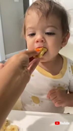 Toddler Pretends to Eat Bread and Enjoy it-1343704