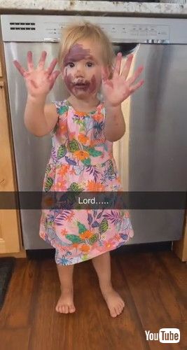 「Little Girl Puts Mother's Lipstick All Over Her Face - 1297583」