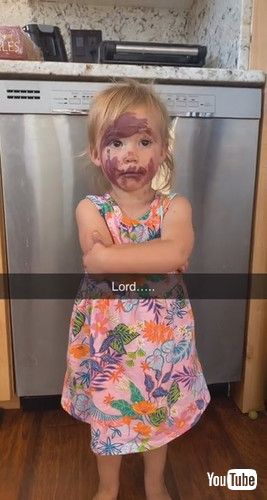 「Little Girl Puts Mother's Lipstick All Over Her Face - 1297583」