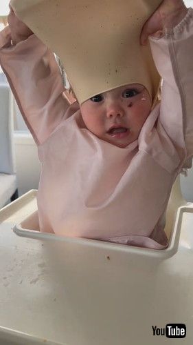 「Baby Tries to Take Her Bib Off || ViralHog」