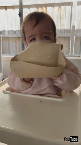 「Baby Tries to Take Her Bib Off || ViralHog」