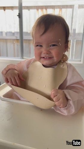 「Baby Tries to Take Her Bib Off || ViralHog」