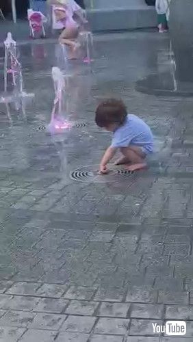 「Toddler Gets Scared of Water Gushing Out of Fountain - 1371235」