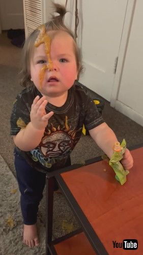 「Baby Spills Food All Over Himself After Squeezing it Out of Packet - 1375021」