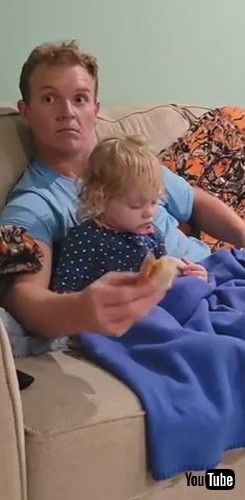「Dad's Hilarious Reaction to Toddler Dozing Off in His Arms - 1380264」