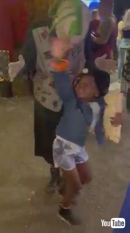 「Scared Kid Screams And Runs Away From Clown Standing Behind Her - 1376975」