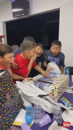 「Boy and His Friends Get Excited Over Him Getting Gaming Console for Birthday Gift - 1390033」