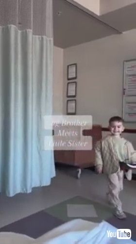 「Toddler Brother Meets His Newborn Sister For First Time - 1412333」