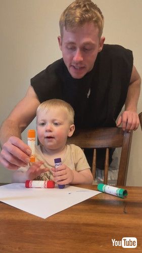 「Dad Corrects Toddler as He Identifies Different Colored Crayons as Pink - 1432950」