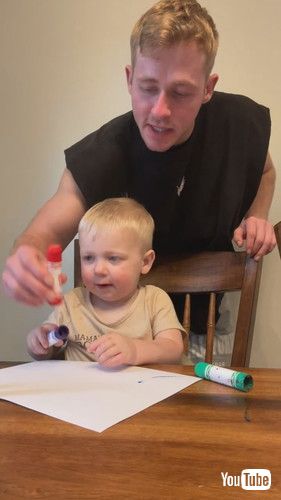 「Dad Corrects Toddler as He Identifies Different Colored Crayons as Pink - 1432950」