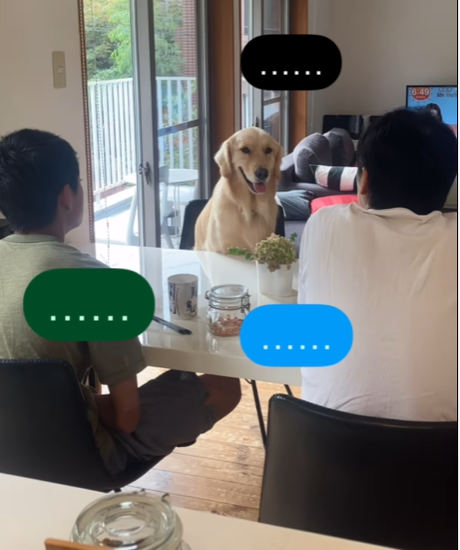 テーブルにつく犬