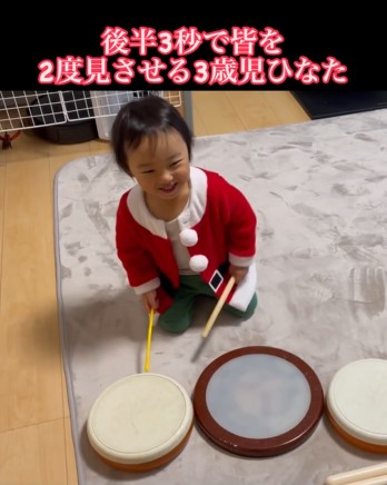 バチを持つ男の子