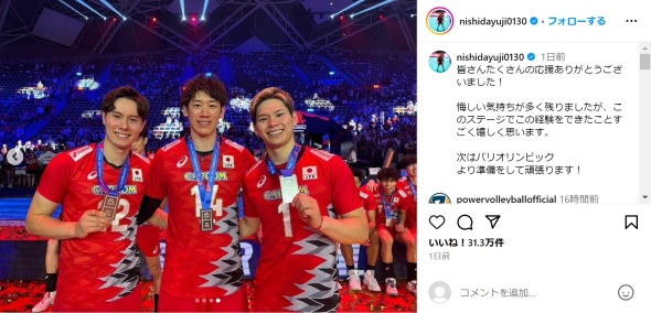 メダルを手に笑顔で写る西田さん