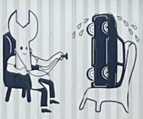 シュールな車修理業者の看板