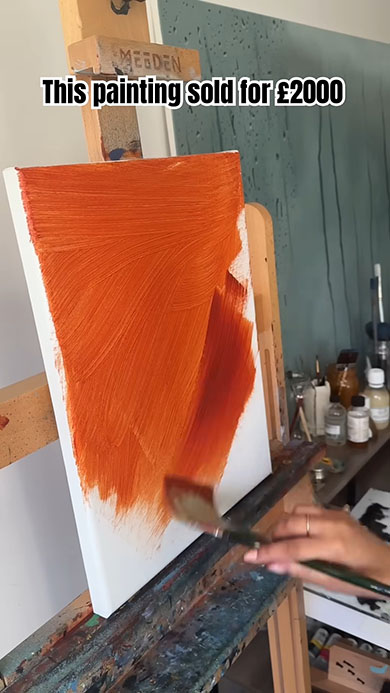 白無地のキャンパスに赤色のインクを塗っているところ